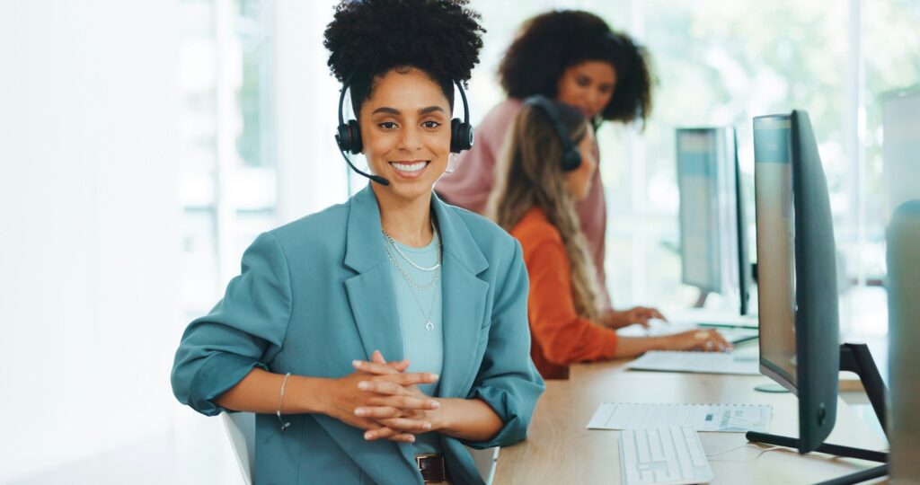 Black woman, call center and contact us with CRM and portrait in office with smile and professional